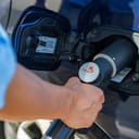 Refueling the car with hydrogen at a hydrogen fuel station