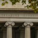 The inscription "The Treasury Department" on the facade of the United States Treasury Department building in Washington, DC, USA.