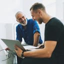 Two men having a conversation in a business environment