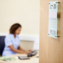 Female nurse working at her desk in an office setting