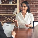 a young woman talking during a job interview