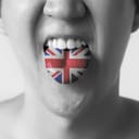 Great Britain flag painted in tongue of a man - indicating English and British language and speaking in Black and White tone