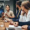 Woman speaks during a business meeting.