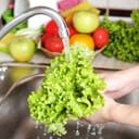Vegetables washing in the kitchen sink