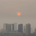 High angle horizontal building shot of sunset in Beijing on a foggy day