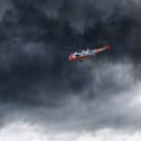 Helicopter in Norway seen from below in front dramatic sky.