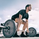 A young man getting read to do a deadlift