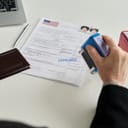 A visa application being stamped as "approved"