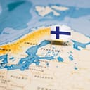 A geographical map of Finland with a pinned flag