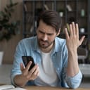 An upset man feels outraged by a weak wifi signal. 