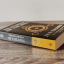 Lord of the Rings The Fellowship of the Ring book on a wooden table