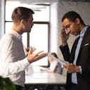 Two businessmen arguing in an office