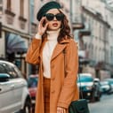 Fashionably dressed girl posing on the street