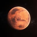 red surface of the planet Mars, also known as the Red Planet