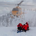 North Shore Search and Rescue are rescuing a skier on a bad weather day.