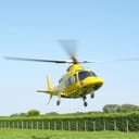 helicopter landing in a field