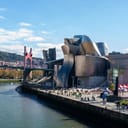 a view at the Guggenheim Museum and the bridge next to it at Bilbao, Spain