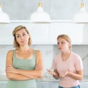distressed daughter trying to convince her mother to go to a party