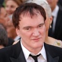 A close-up of Quentin Tarantino in a suit during an awards ceremony