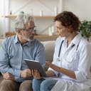 Doctor briefs patient about risks of a surgery.