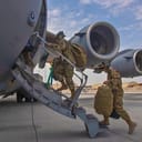 U.S. airmen boarding a C-17 Globemaster at Al Udeid Air Base, the withdrawal on April 27, 2021.