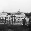 Troops of the 51st Highland Division offloading supplies from tank landing craft during the initial day of the Allied invasion of Sicily on July 10, 1943.
