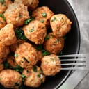 Plate with delicious turkey meatballs on a table