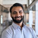 a portrait of a smiling Indian man