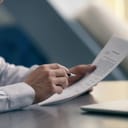 close-up of a businessman reading a contract