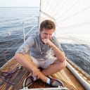 A man feeling nauseous on a boat