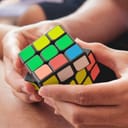 Rubik's cube in human hands colorful