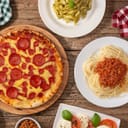 Selection of Italian dishes on a wooden table