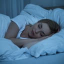 A woman sleeping peacefully in her bed