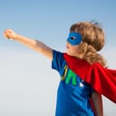 boy wearing a superhero costume