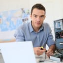 An IT specialist working on a computer hardware