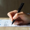 A woman filling out a document