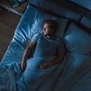 Man sleeping in a bed