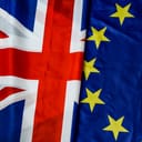 Post-Brexit tensions symbolized by EU and UK flags.