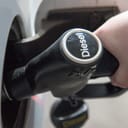 A person pouring Diesel fuel into their car