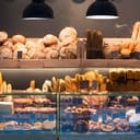 A modern bakery selling bread, cakes and buns