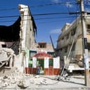 A man exits a restaurant after he looked for his belongings. An earthquake rocked Port au Prince on January 12, 2010.