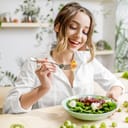 A young woman eating healthy food.