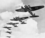 A vintage photo of six German WW2 airplanes in the sky