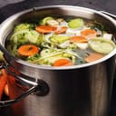 Potful of vegetable stock on a stove