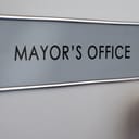 Mayor's office door with a sign on them