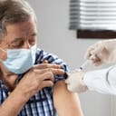 elderly man getting coronavirus vaccine