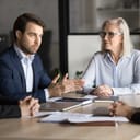 young male project manager confidently discussing work plans and strategies with colleagues during a meeting in the office