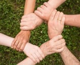 Group of people holding each other's wrists