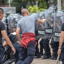police in conflict with protesters during a riot