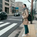 A woman checking whether she can cross the street on a crosswalk
